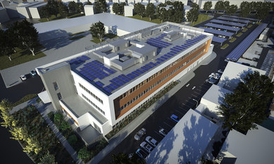 Aerial perspective illustration of San Mateo County Wellness Center showing its extensive solar panel arrays on the roof and as shade structures in the parking lot.