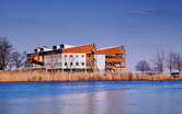 Photo of the Philip Merrill Environmental Center highlighting its integration into its natural setting along the Chesapeake Bay