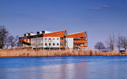 Photo of the Philip Merrill Environmental Center highlighting its integration into its natural setting along the Chesapeake Bay